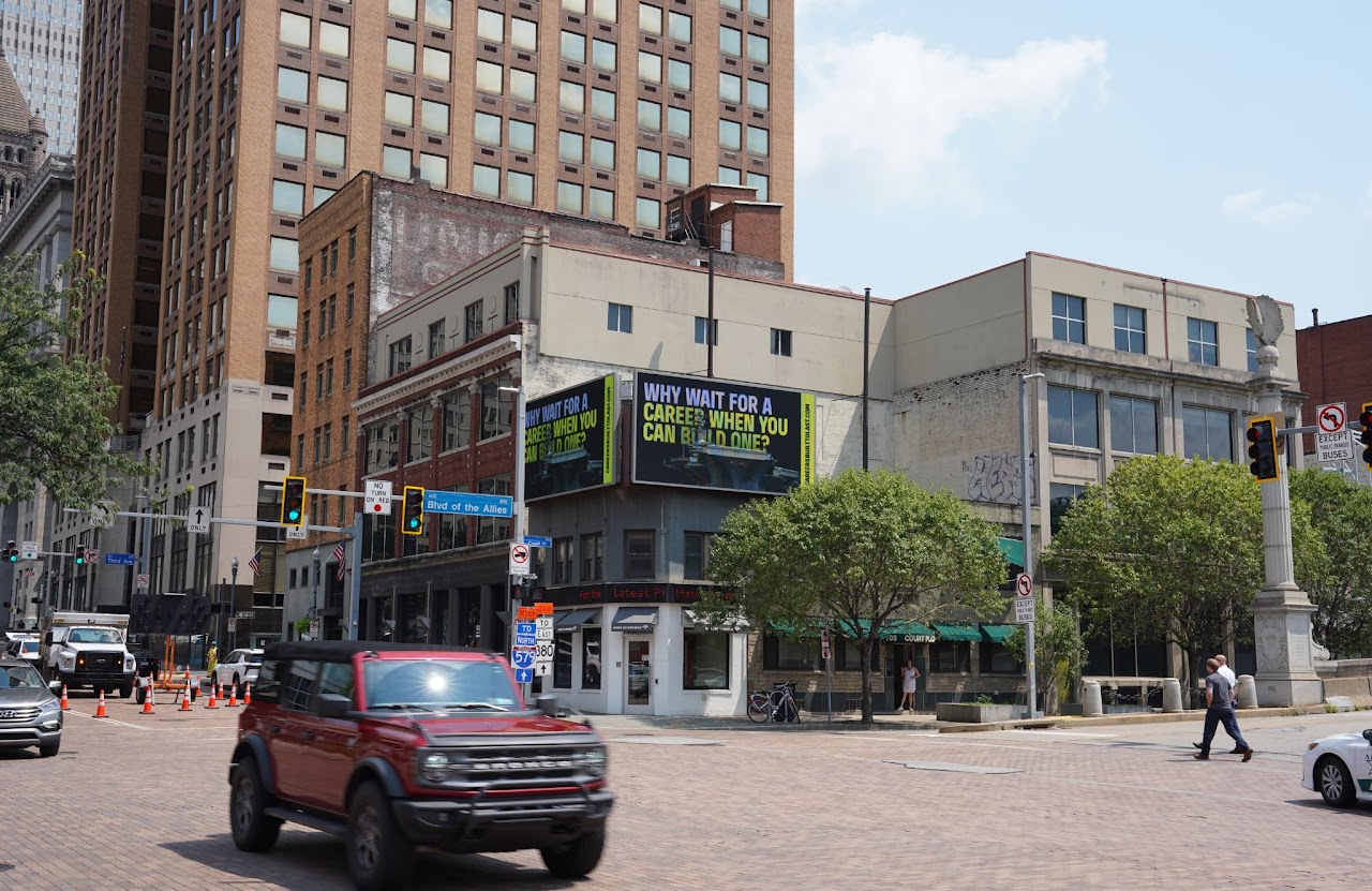 BlueForge Alliance 'Why Wait For A Career' billboard wide street view near PPG Paints Arena, Pittsburgh
