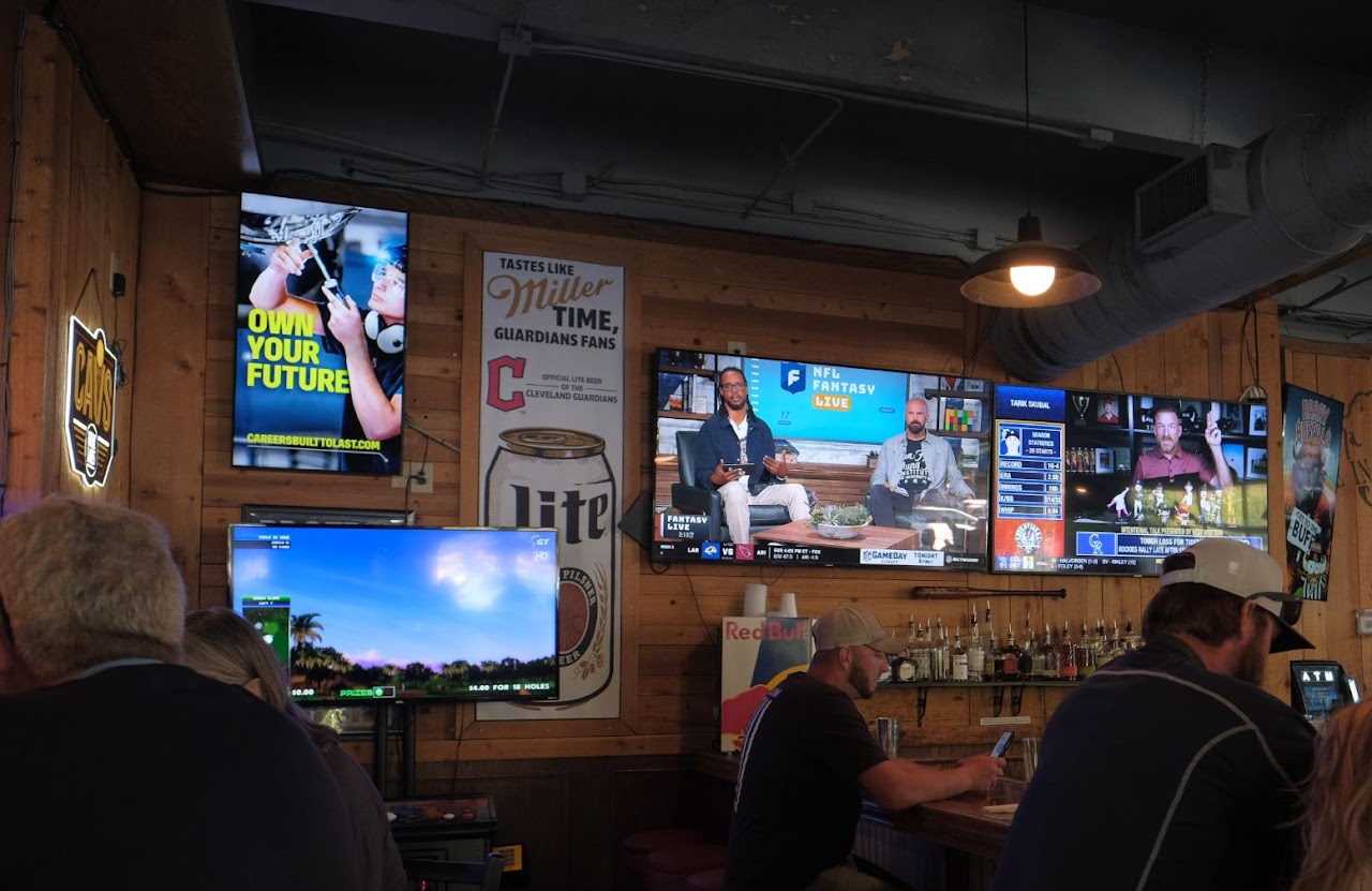 BlueForge Alliance 'Own Your Future' screen alongside live sports, Cleveland bar