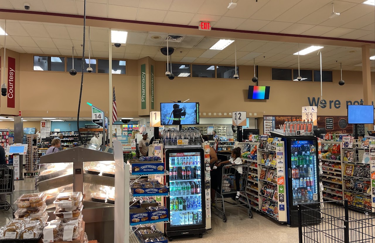 BlueForge Alliance creative on overhead grocery screen, ShopRite Philadelphia DMA