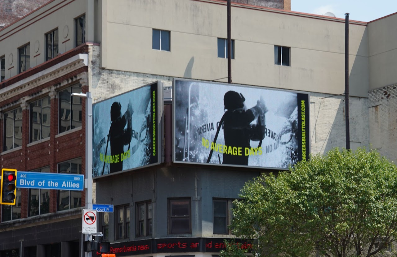 BlueForge Alliance 'No Average Days' welding creative on dual digital billboards, downtown Pittsburgh