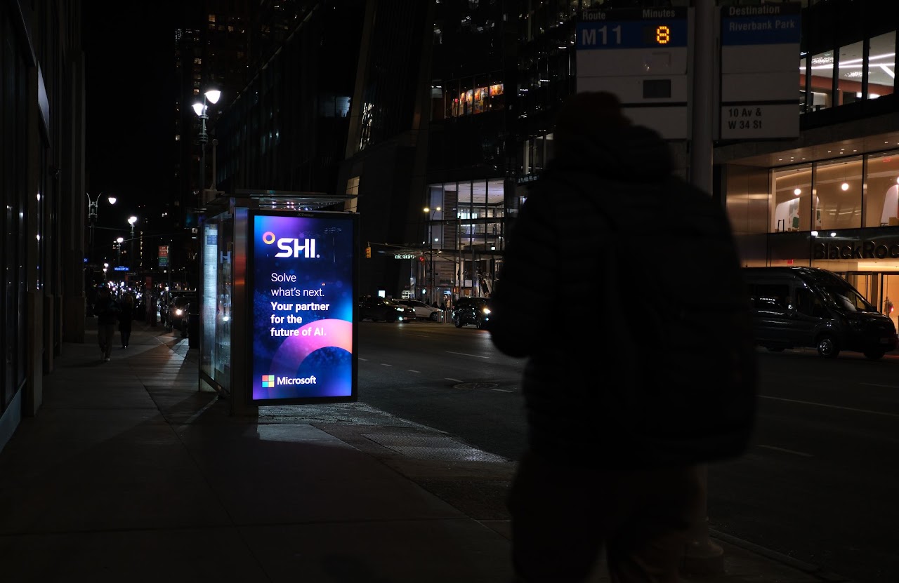SHI x Microsoft bus shelter at night, NYC midtown