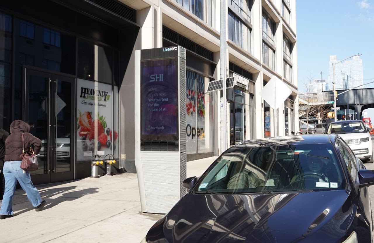 SHI x Microsoft LinkNYC kiosk — daytime storefront context, NYC