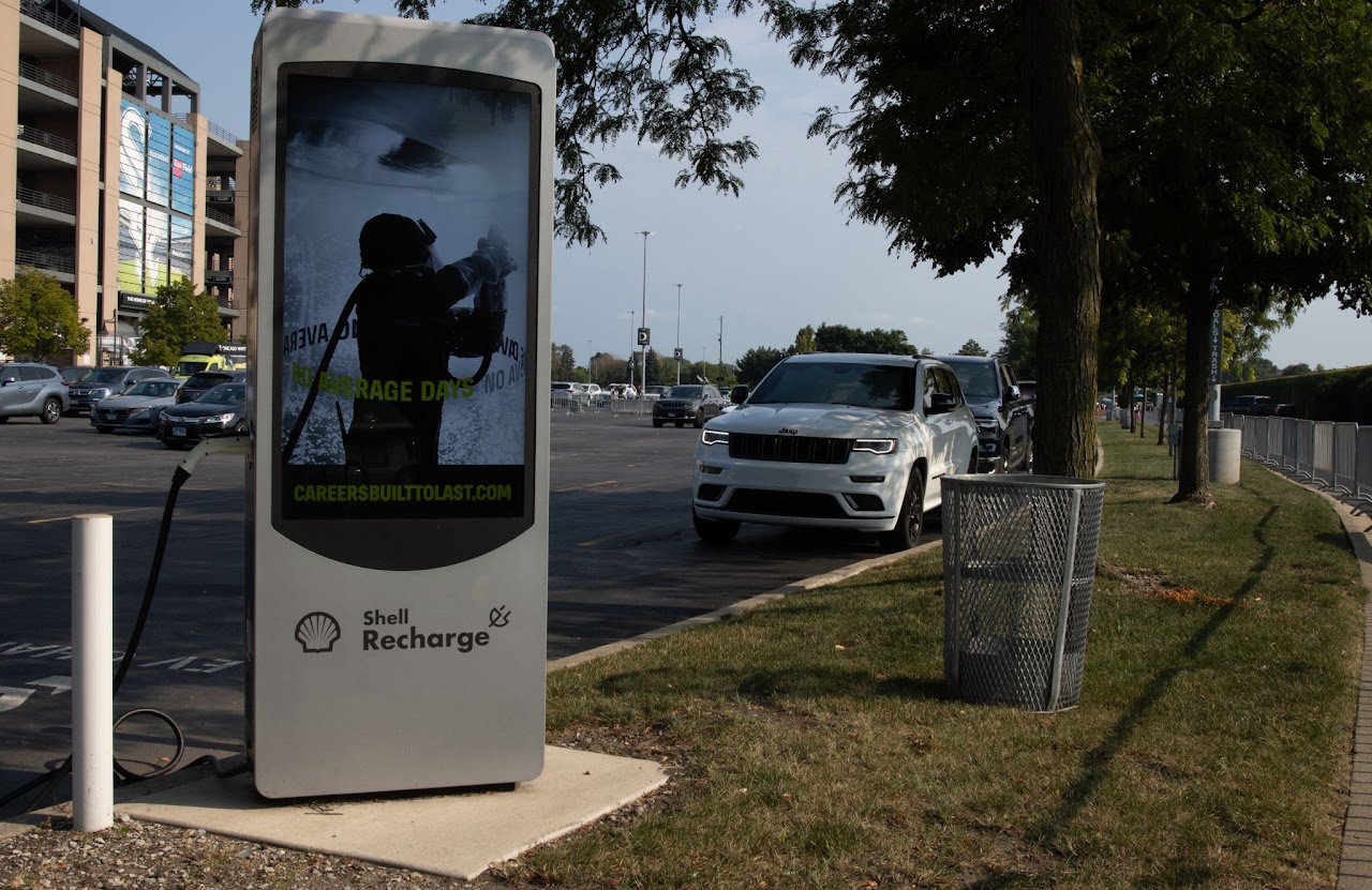 BlueForge Alliance 'No Average Days' Shell Recharge EV charging station screen outside Guaranteed Rate Field, Chicago