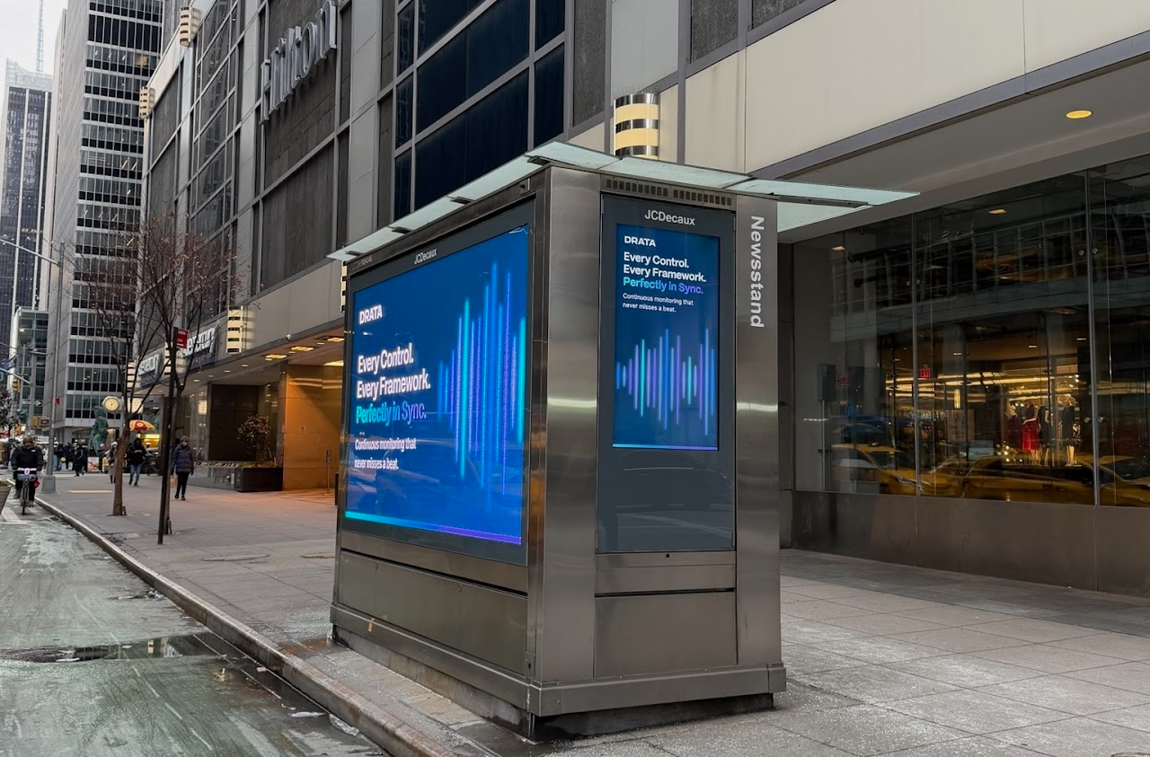 Drata two-sided JCDecaux newsstand outside Hilton, Midtown Manhattan
