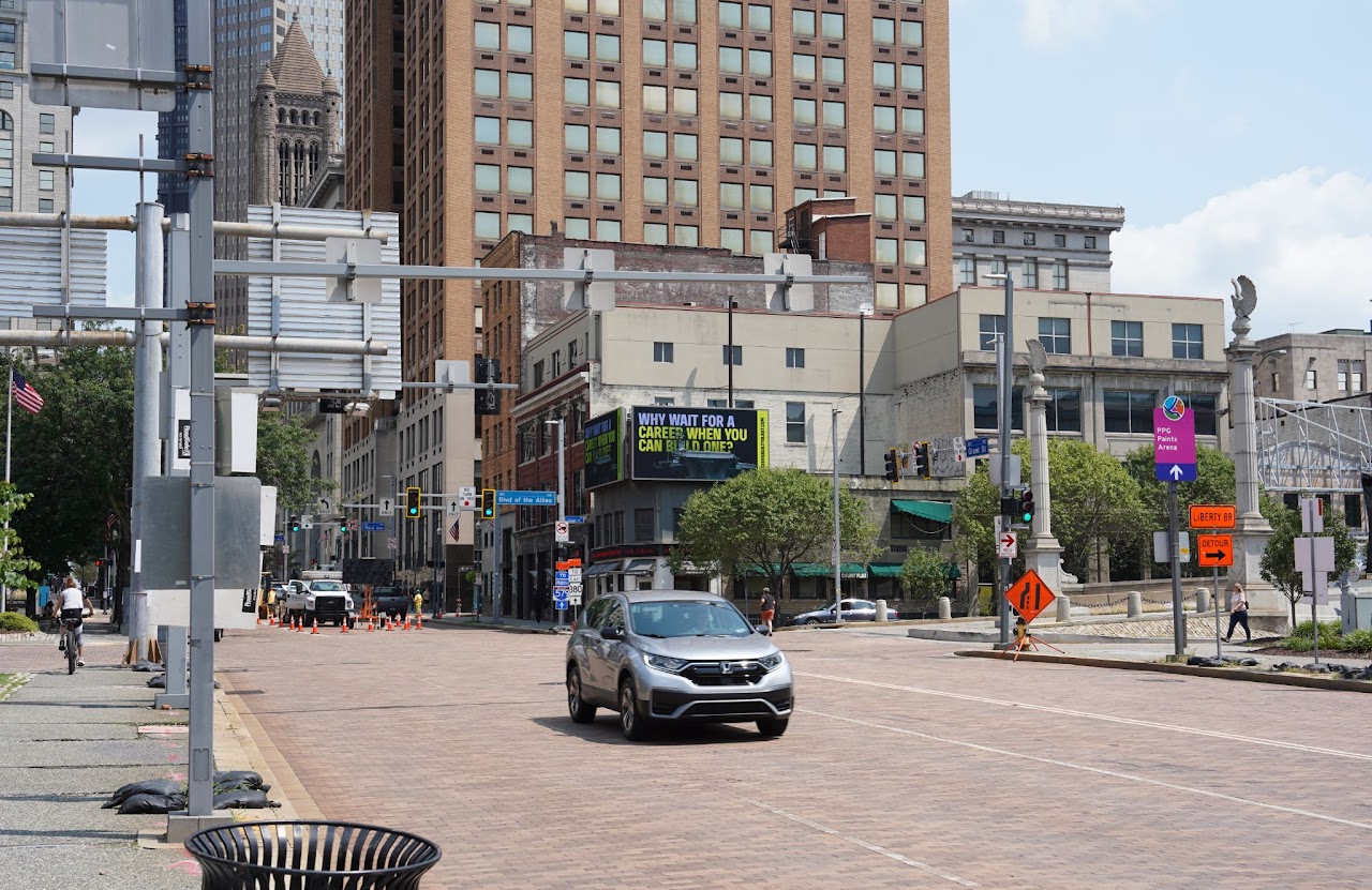 BlueForge Alliance 'Why Wait For A Career' billboard, Blvd of the Allies skyline view, Pittsburgh