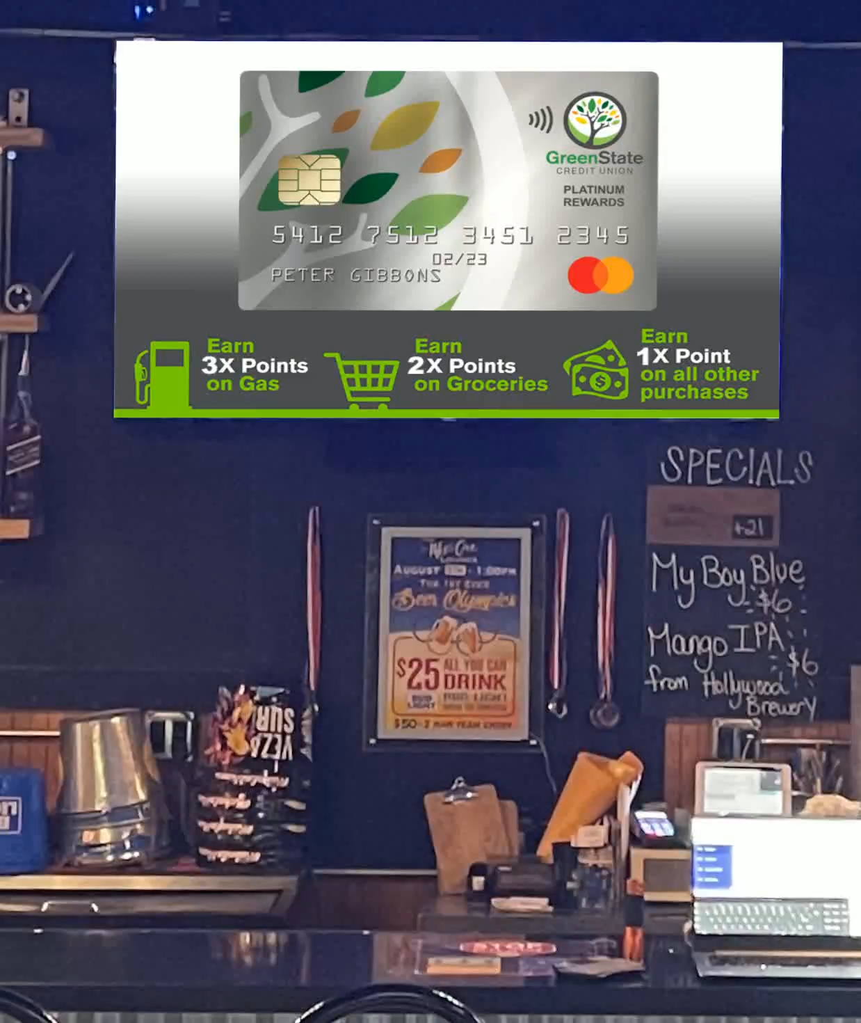 GreenState Credit Union rewards-card creative on a casual-dining screen