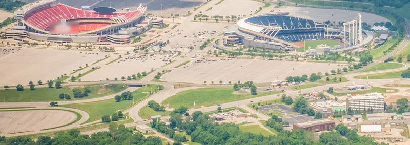 Aerial of the Kansas City stadium complex surrounded by parking.